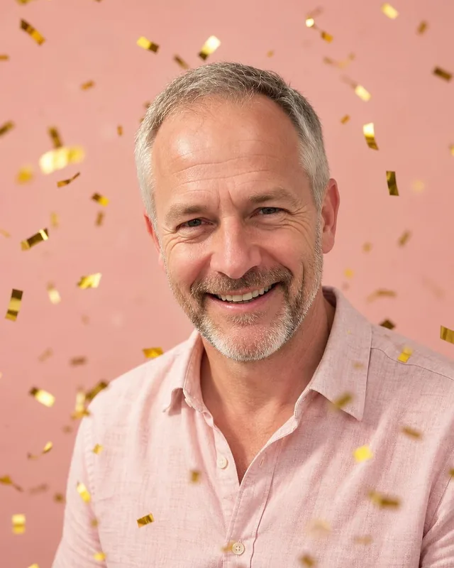 AI birthday photo: man in a pink linen shirt in falling gold confetti