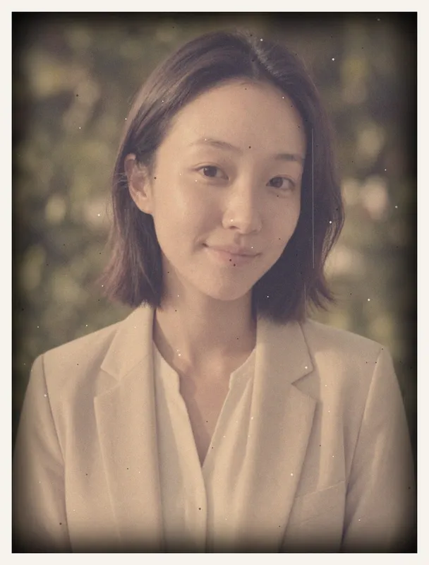 Old photo before restoration: damaged old faded 1970s color portrait of a woman: faded, color-shifted and dusty